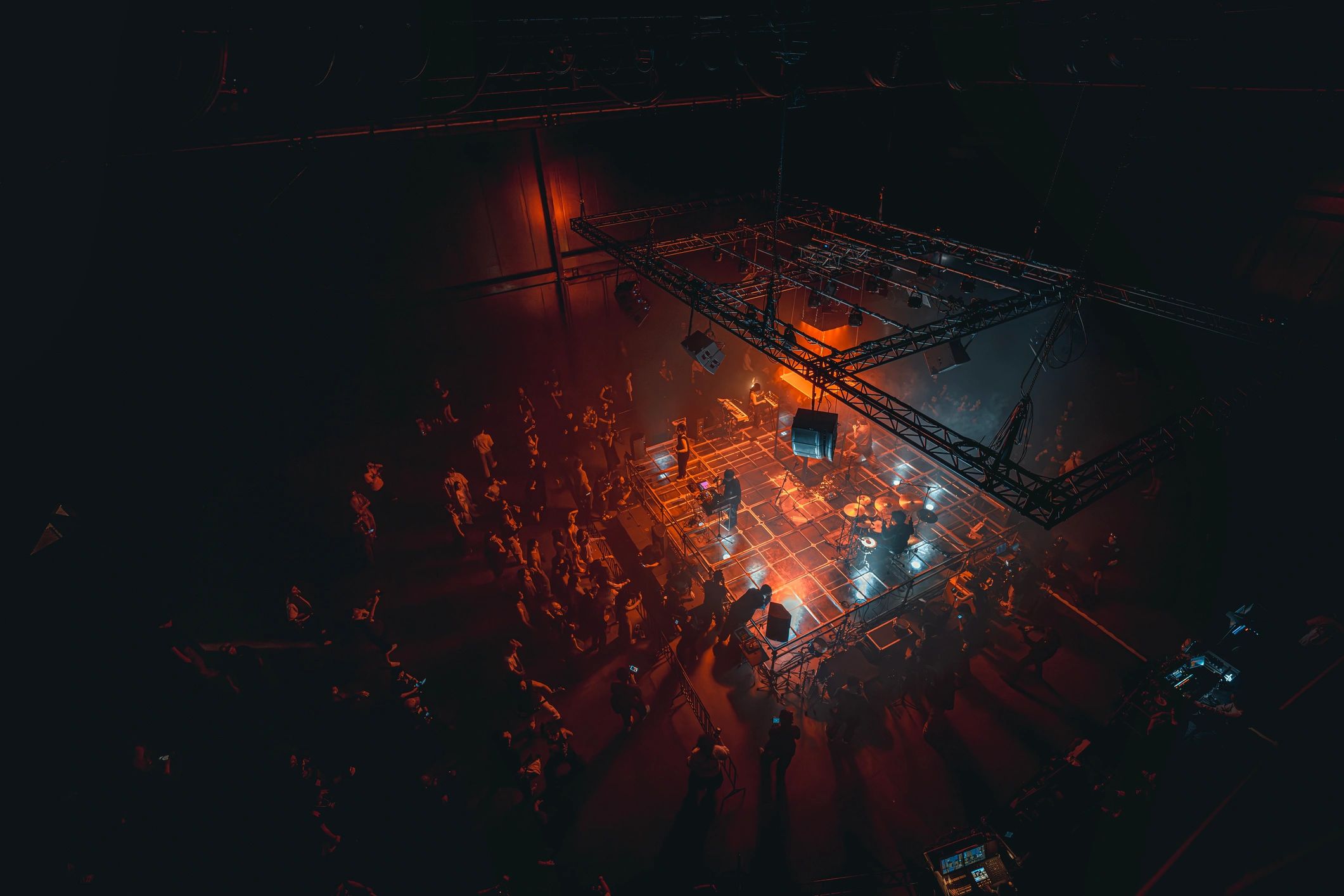 Live musicians performing on an illuminated concert stage