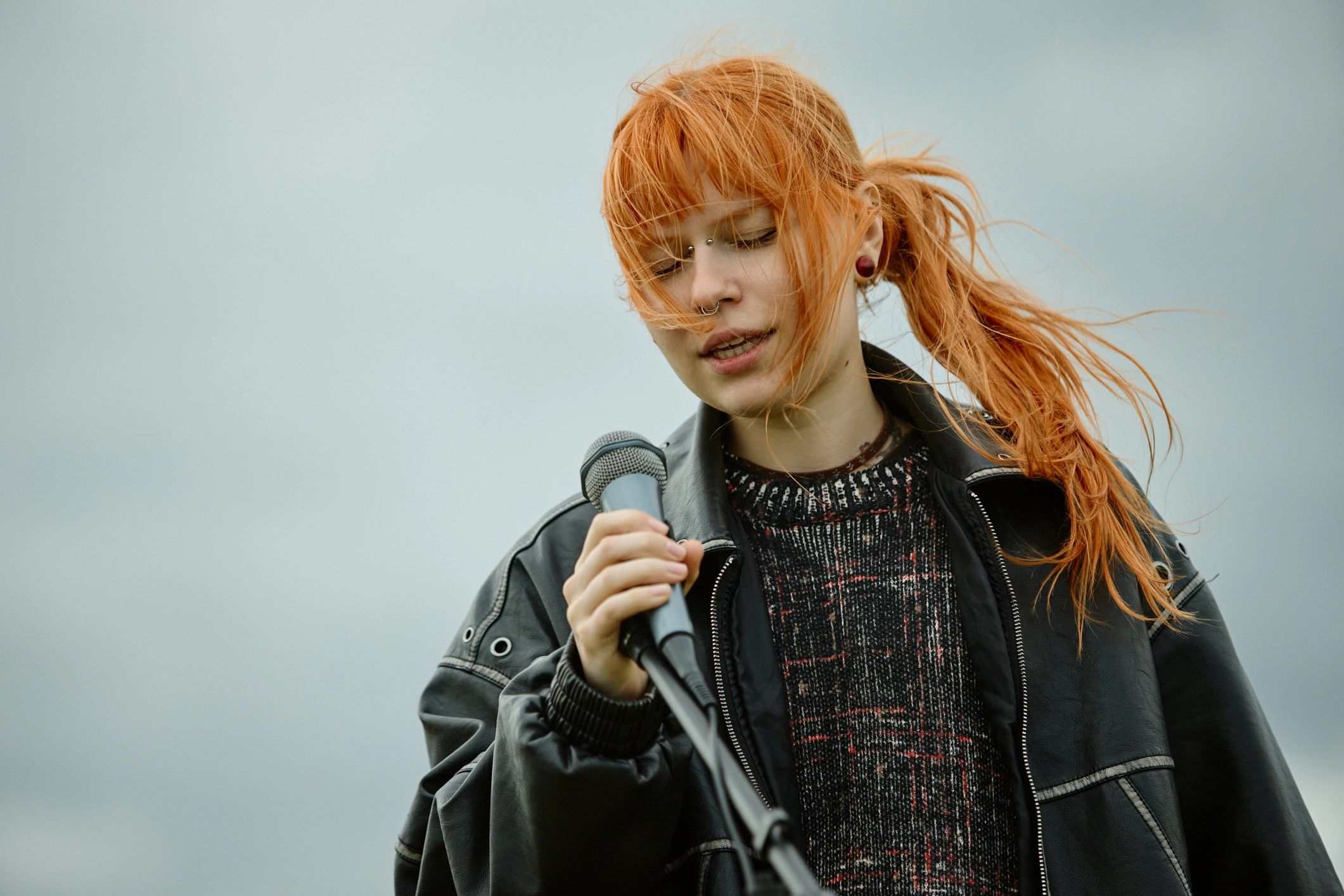 Texas music performer singing into a microphone