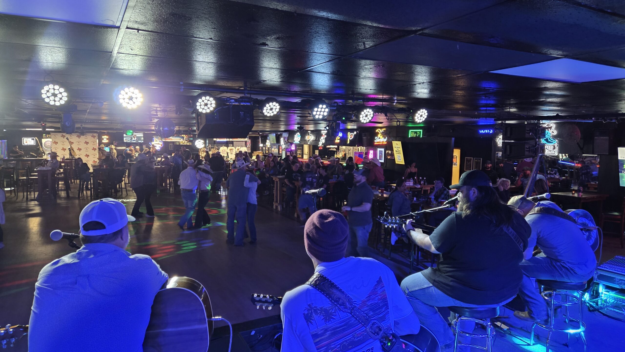 Live band performing for a crowd at a Texas music venue
